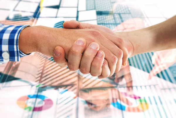 Handshaking business person in casual wear with charts in background. Concept of teamwork and partnership — Stock Photo, Image