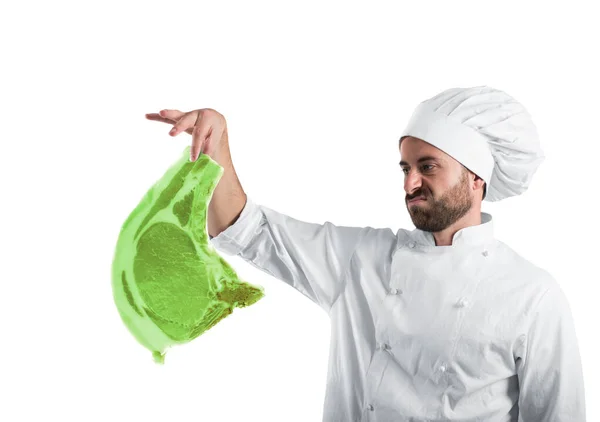 Chef with radioactive and contaminated meat steak. Concept of pollution, unhealthy and harmfulness — Stock Photo, Image