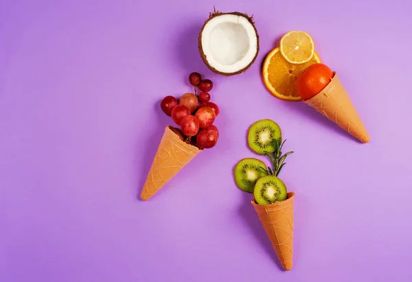 Ice cream with natural fruits. Concept of genuine and biologic fruit. Purple background