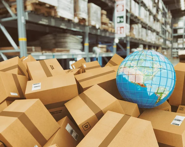 Earth globe on a pile of boxes in a shipping warehouse — 스톡 사진