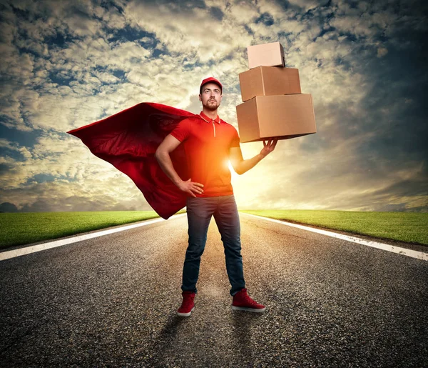 Courier acts like a powerful superhero in a street. Concept of success and guarantee on shipment — ストック写真