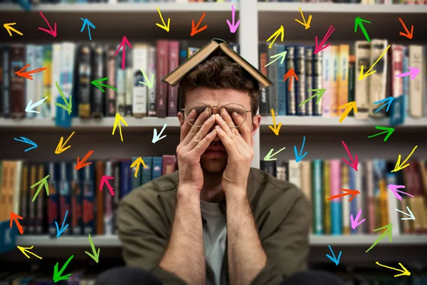 Tired university student has difficulty to study. Full of arrows and way to follow. Concept of stress and difficulty — Stok fotoğraf