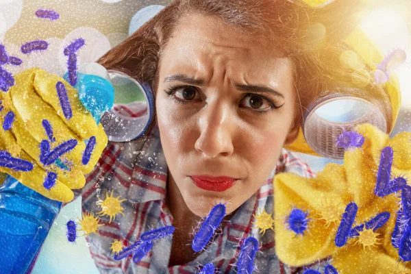 Funny housewife cleans and disinfects to keep germs, viruses and bacteria away. — Stock Photo, Image