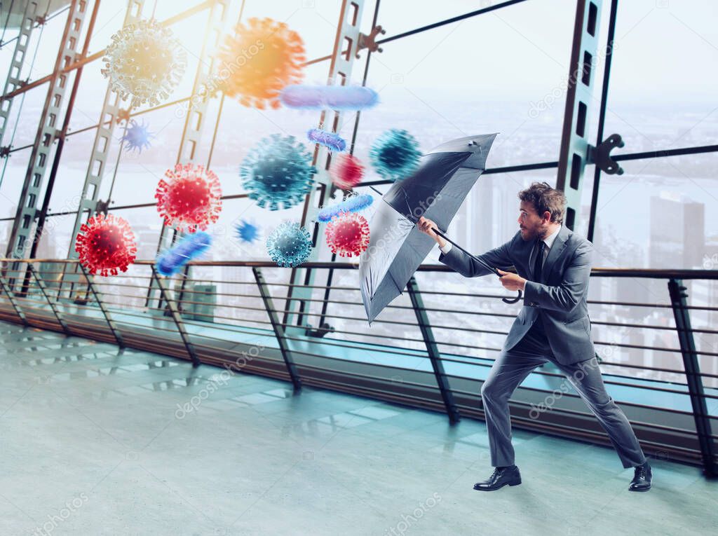 Businessman with umbrella covers himself from bacteria. Concept of solution to stop viruses contamination and pandemic