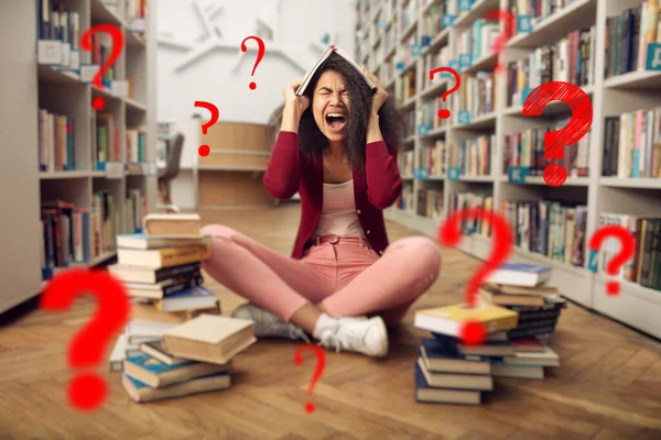 Tired university student has difficulty to study. Concept of stress, question and difficulty — Stock Photo, Image