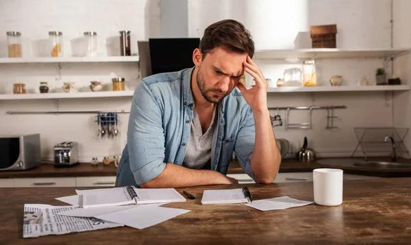 Boy has problems with bills. Concept of economic trouble and failure — Stock Photo, Image