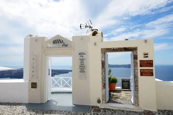 FIRA, GREECE - MAY 17: The entrance to Iriana cafe on May 17, 2014 in Fira, Greece. Up to 16 mln tourists is expected to visit Greece in year 2014. — Stock Photo, Image