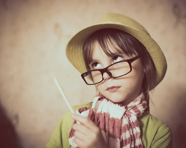 Little girl in hat and glasses. — Stock Photo, Image