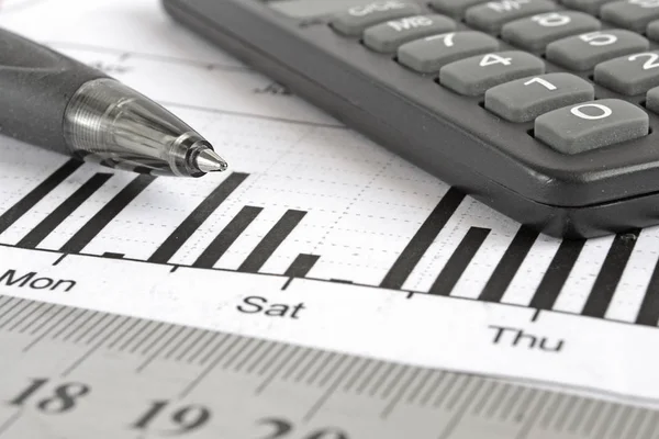 Business background with graph, pen, ruler and calculator — Stock Photo, Image