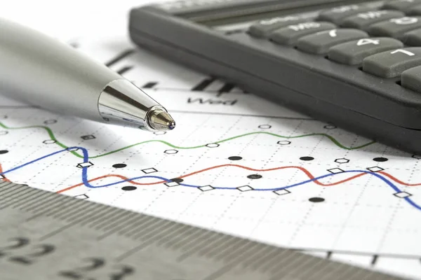 Business background with graph, ruler, pen and calculator Stock Photo