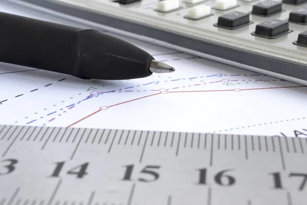 Business background with graph, ruler, pen and calculator — Stock Photo, Image