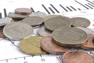 Farklı sikke ve grafik ile finansal arka plan