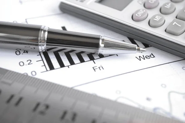 Business background with graph, ruler, pen and calculator — Stock Photo, Image