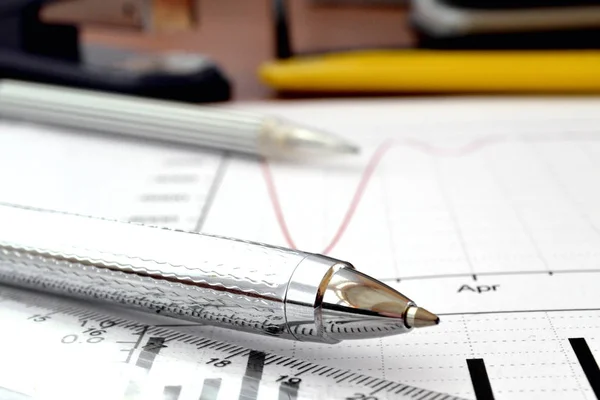Business background with graph, pen and ruler — Stock Photo, Image