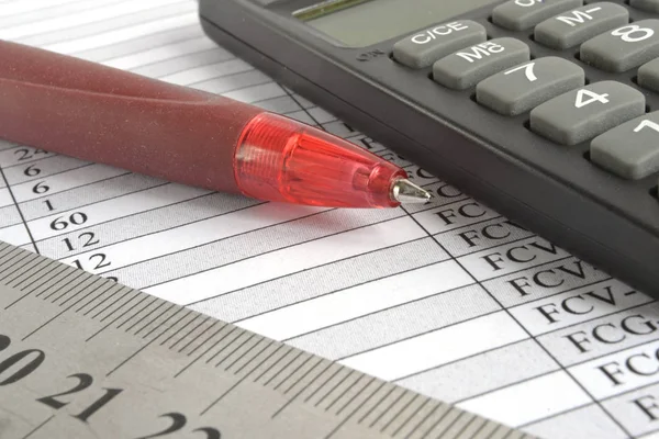 Business background with table, pen and calculator.