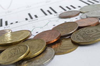 Farklı sikke ve grafik ile finansal arka plan