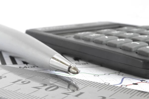 Business background with graph, ruler, pen and calculator — Stock Photo, Image