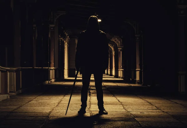 lonely man with sword in the night