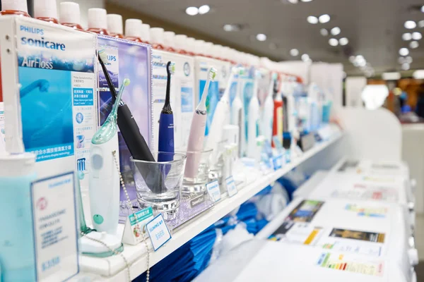 Electric toothbrushes at electronic store — Stock Photo, Image