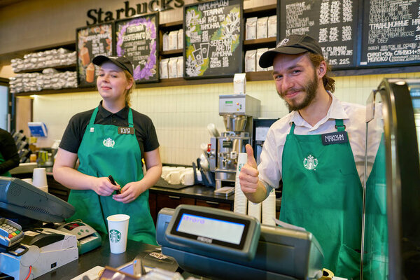 RUSSIA, SAINT PETERSBURG - CIRCA OCTOBER, 2017: Portrait of staff at Starbucks coffee shop in Saint Petersburg