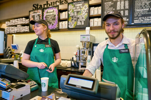 RUSSIA, SAINT PETERSBURG - CIRCA OCTOBER, 2017: Portrait of staff at Starbucks coffee shop in Saint Petersburg