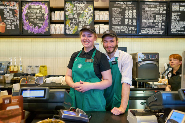RUSSIA, SAINT PETERSBURG - CIRCA OCTOBER, 2017: Portrait of staff at Starbucks coffee shop in Saint Petersburg