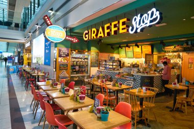DUBAI, UAE - CIRCA JANUARY 2019: Giraffe Stop at Dubai International Airport.
