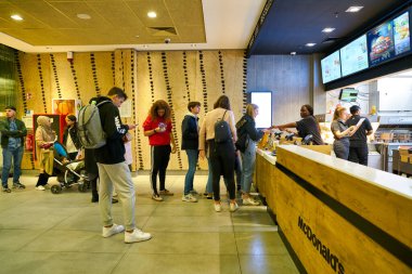 BERLIN, GERMANY - CIRCA SEPTEMBER, 2019: counter service at McDonald's restaurant in Berlin.