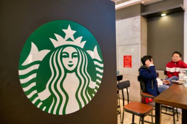 SHENZHEN, CHINA - CIRCA JANUARY,  2019: Starbucks Siren sign seen at coffee shop in Shenzhen.