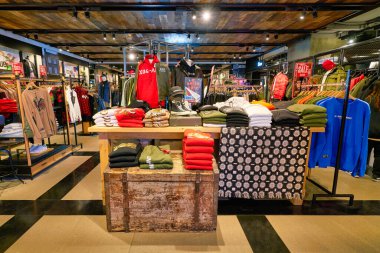 HONG KONG, CHINA - JANUARY 23, 2019: clothes on display at a store in New Town Plaza. New Town Plaza is a shopping mall in the town centre of Sha Tin, Hong Kong.