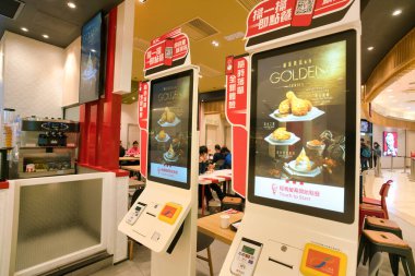 HONG KONG, CHINA - CIRCA FEBRUARY, 2019: self service kiosks at Kentucky Fried Chicken restaurant in Hong Kong. KFC is an American fast food restaurant chain.