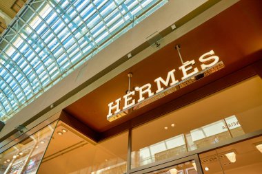 SINGAPORE - CIRCA APRIL, 2019: Hermes brand name over store entrance in The Shoppes at Marina Bay Sands.