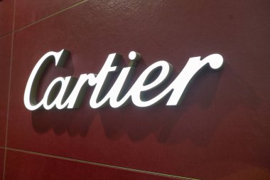DUBAI, UAE - CIRCA JANUARY 2019: close up shot of Cartier sign Dubai International Airport.