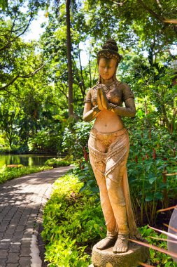 BANGKOK, THAILAND - CIRCA JUNE, 2015: statue seen at tropical garden at Swissotel Nai Lert Park in Bangkok.