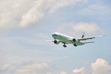 HONG KONG, CHINA - 04 JUNE, 2015: a Cathay Pacific Boeing 777 arrives at Hong Kong International Airport