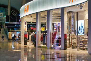 DUBAI, UAE - CIRCA FEBRUARY, 2019: view of H&M storefront in Dubai International Airport.