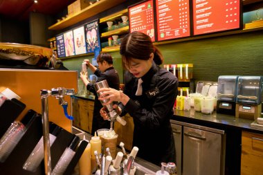 SHENZHEN, CHINA - CIRCA FEBRUARY,  2019: barista prepare drinks at Starbucks in Shenzhen.