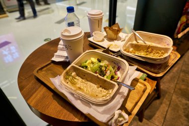 SHENZHEN, CHINA - CIRCA FEBRUARY,  2019: left food on trays at Starbucks in Shenzhen.