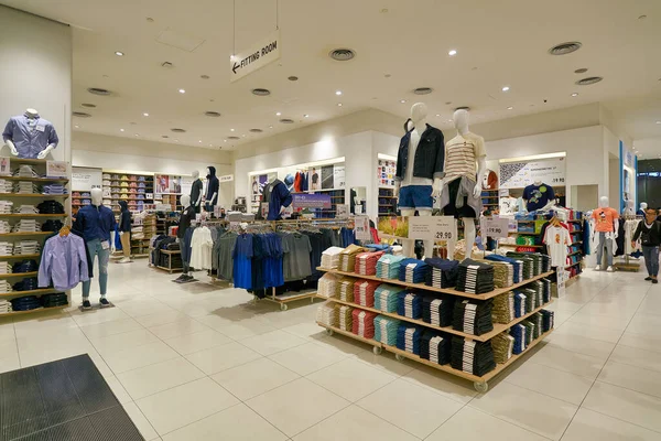 SINGAPORE - APRIL 03, 2019: clothes on display at Uniqlo store in Singapore. Uniqlo is a Japanese casual wear designer, manufacturer and retailer.