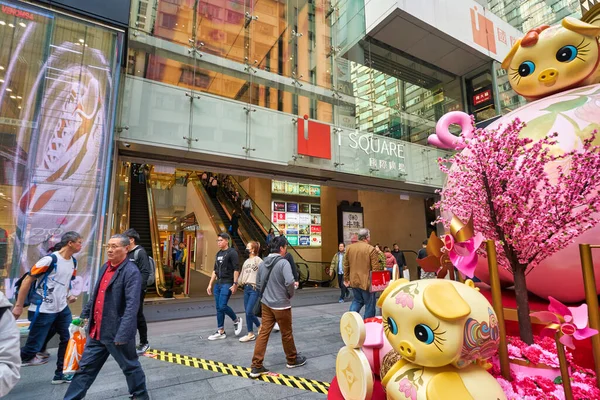 HONG KONG, CHINA - CIRCA JANUARY, 2019: small piggy banks are around of 6-meter high piggy bank statue sitting in the iSquare entrance.