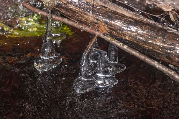 Icicles above the water — Stock Photo, Image