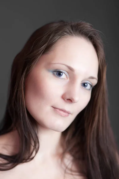 Girl with blue eyes closeup — Stock Photo, Image