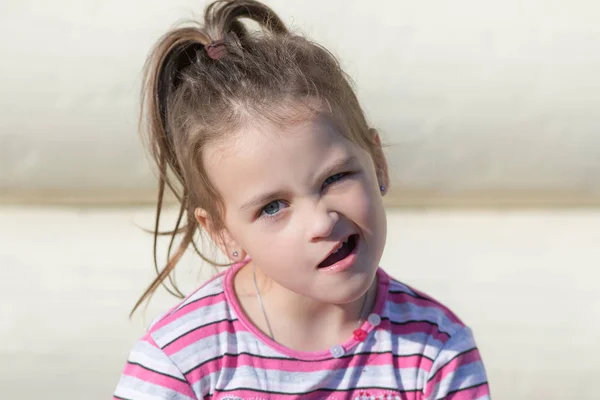 Little girl with a skeptical look — Stock Photo, Image