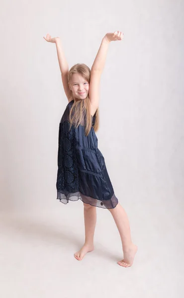 Cheerful girl in a blue dress — Stock Photo, Image