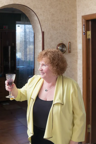 Woman with a glass of red wine — Stock Photo, Image