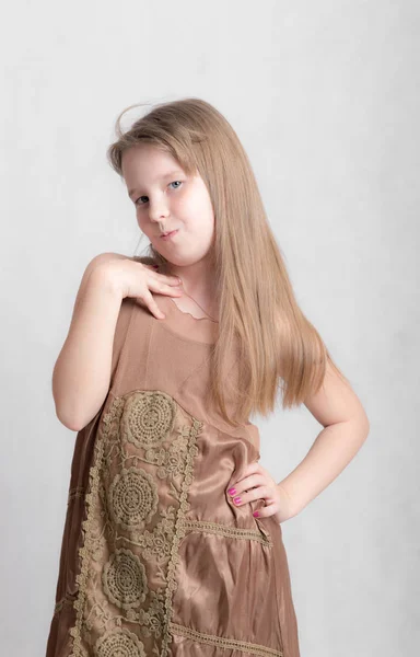 Girl in a brown dress — Stock Photo, Image