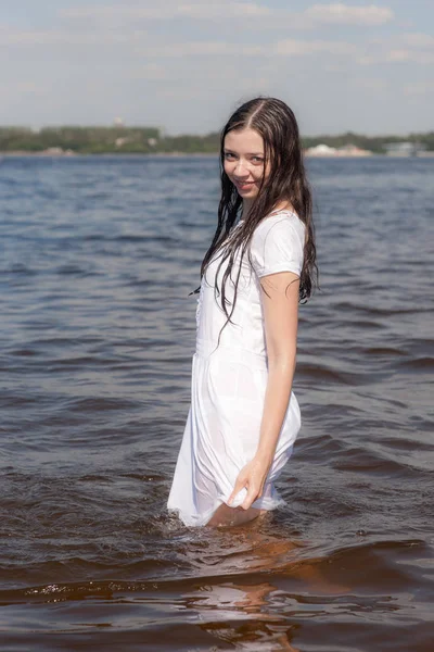 Slender girl in white dress — Stock Photo, Image