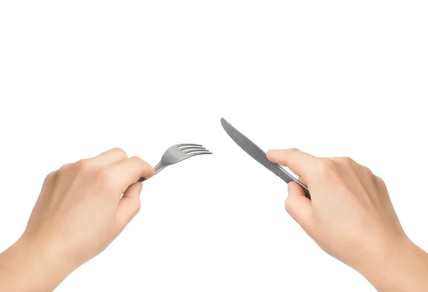 Manos con cuchillo y tenedor sobre fondo blanco — Foto de Stock