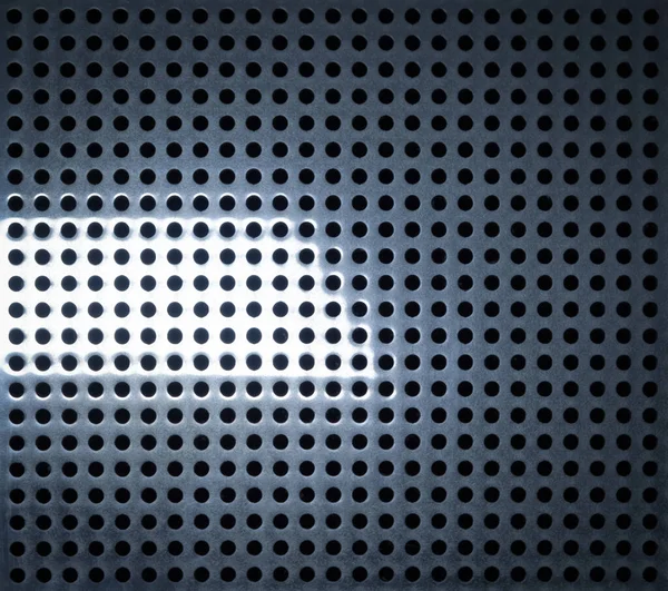 Металлический абстактный фон с отверстиями и светом — стоковое фото