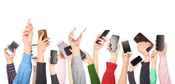 Many hands holding mobile phones — Stock Photo, Image